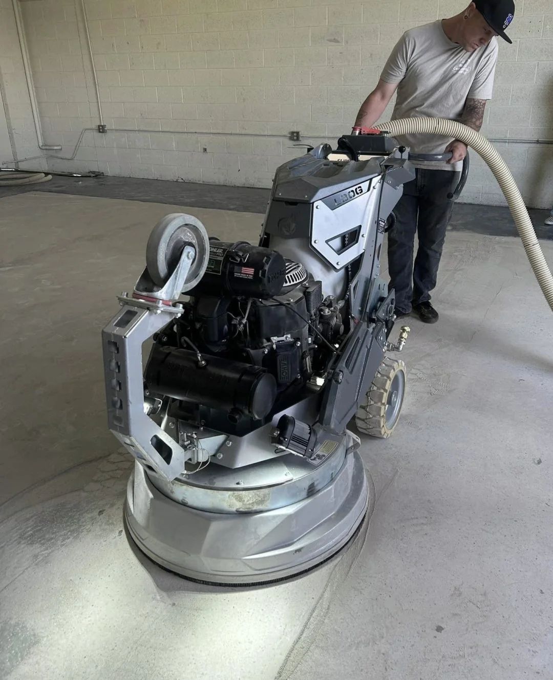 Diamond grinding a concrete slab before coating in Tampa, FL