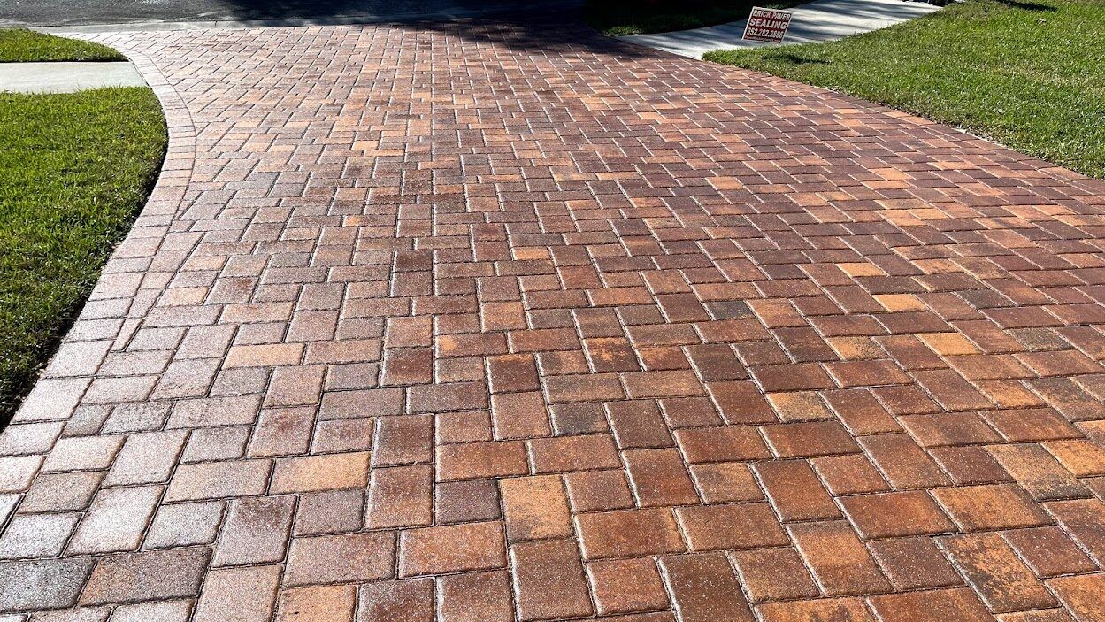 Sealed brick paver driveway with restored colour in Tampa, FL